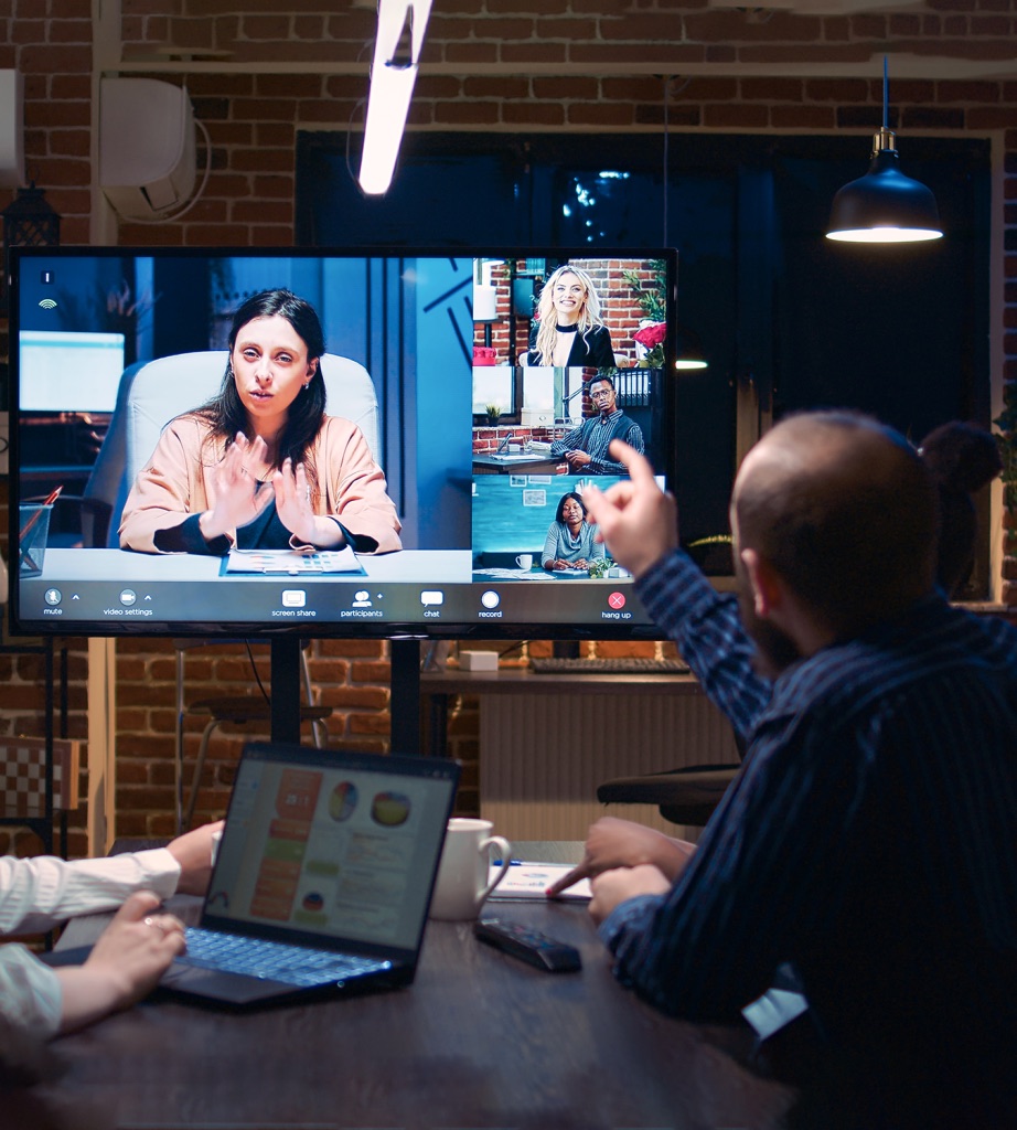 Corporate boardroom with large video conferencing display
