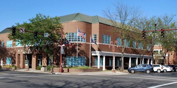 Maumee, Ohio red brick Municipal building with white pillars and trees